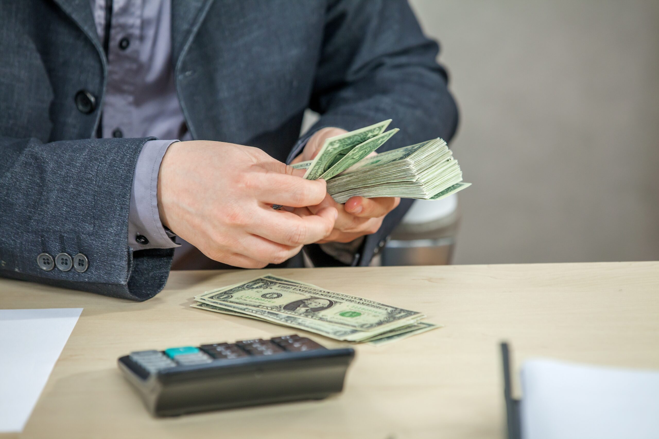businessman calculating money